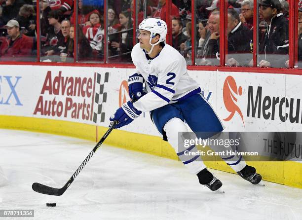 Ron Hainsey of the Toronto Maple Leafs moves the puck against the Carolina Hurricanes during their game at PNC Arena on November 24, 2017 in Raleigh,...