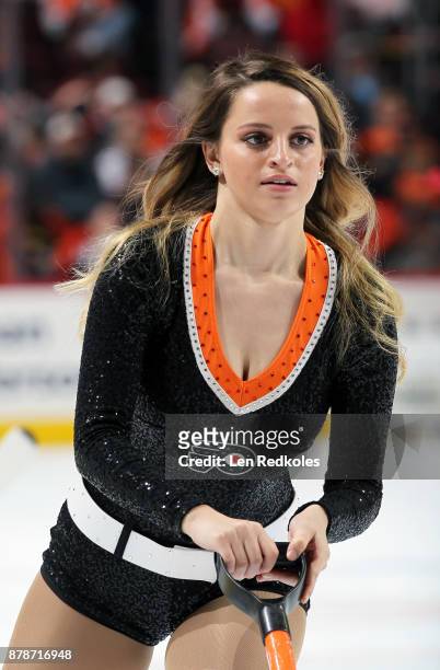Member of the Philadelphia Flyers ice girls cleans the ice during a timeout against the Calgary Flames on November 18, 2017 at the Wells Fargo Center...