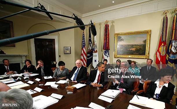 President Barack Obama talks to GE CEO Jeffrey Immelt during a meeting with members of his Economic Recovery Advisory Board in the Roosevelt Room of...
