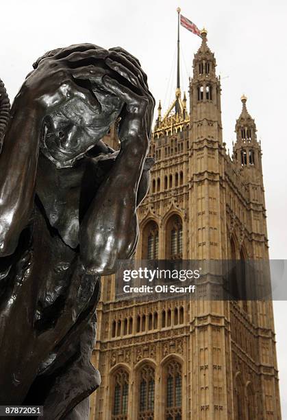 The statue "The Burghers of Calais" by Auguste Rodin stands adjacent to the Union Flag flying on Victoria Tower of the House of Parliament on May 20,...