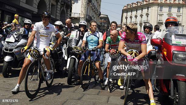 Photographers and riders hold a minute of silence to pay respect to photographer's motorbike pilot Fabio Saccani who died the day before on May 20,...