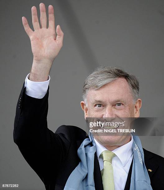 German President Horst Koehler waves as he attend the opening of a protestant church congress in the northern German city of Bremen on May 20, 2009....