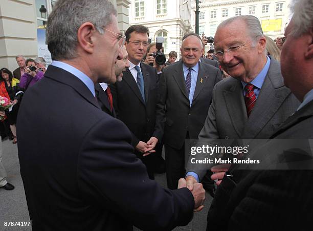 Gerard Mestrallet and King Albert of Belgium shake hands during arrive at the opening of the Magritte Museum on May 20, 2009 in Brussels, Belgium.