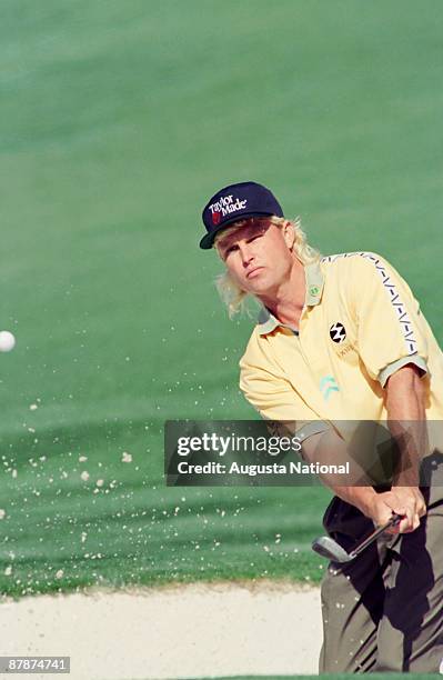 1990s: Bill Glasson hits from a bunker during a 1990s Masters Tournament at Augusta National Golf Club in April in Augusta, Georgia.