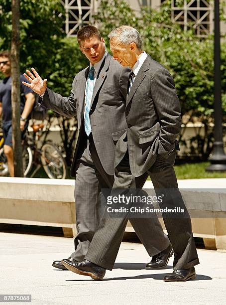 Supreme Court Associate Justice David Souter talks with a security officer before addressing the Sandra Day O'Connor Project on The State of The...