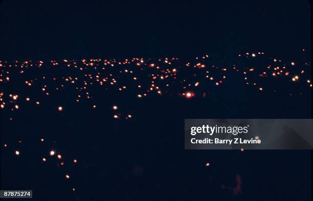 Nighttime view of the fires that dot the festival grounds during the Woodstock Music and Arts Fair in Bethel, New York, August 15 - 17 , 1969.