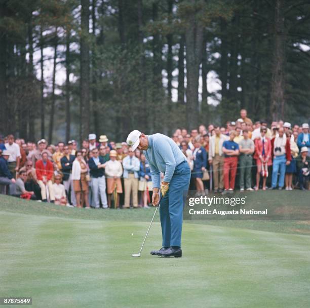 Billy Casper drops his putt during the 1970 Masters Tournament at Augusta National Golf Club in April 1970 in Augusta, Georgia.