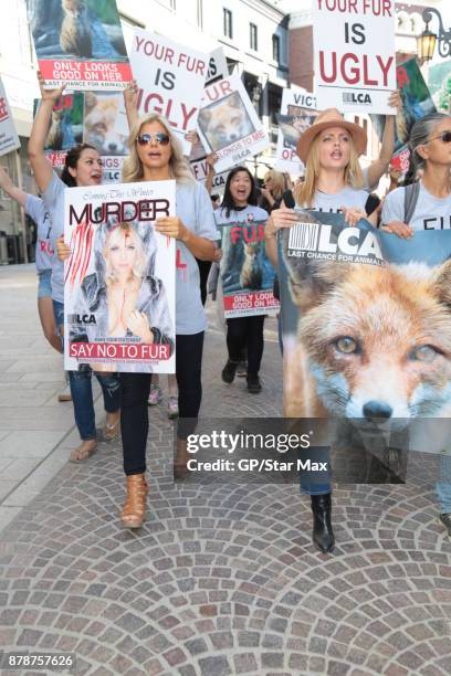 Donna D'Errico and actress Mena Suvari are seen on November 24, 2017 at The Fur Free Friday Peaceful Protest March in Los Angeles, CA.