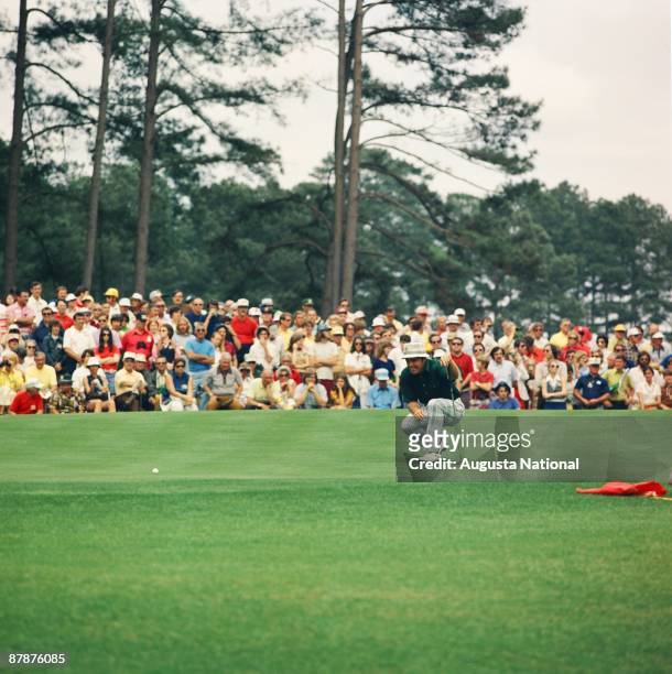 Jim Colbert lines up a putt during the 1974 Masters Tournament at Augusta National Golf Club in April 1974 in Augusta, Georgia.