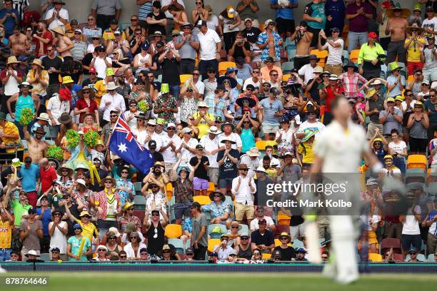 The crowd cheers as Steve Smith of Australia celebrates his century during day three of the First Test Match of the 2017/18 Ashes Series between...