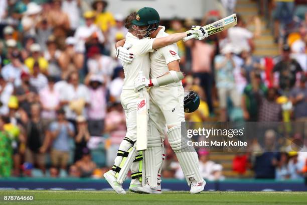 Steve Smith of Australia embraces Pat Cummins of Australia as he celebrates his century during day three of the First Test Match of the 2017/18 Ashes...