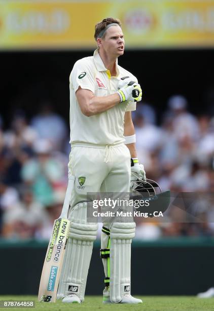 Steve Smith of Australia celebrates and acknowledges the crowd after scoring a century during day three of the First Test Match of the 2017/18 Ashes...
