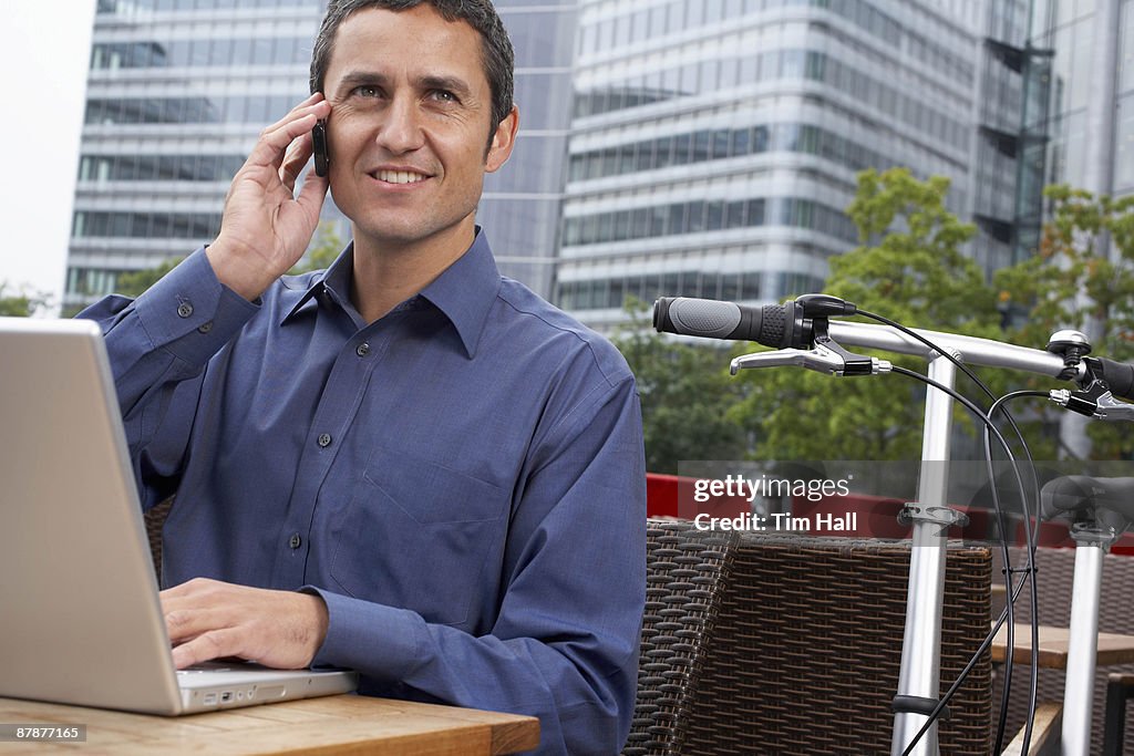 Man working on laptop outside