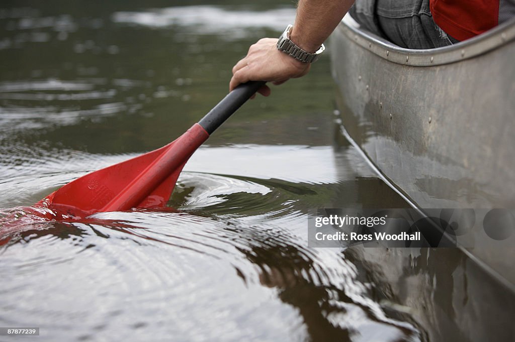 Kayak paddle stroke in water.