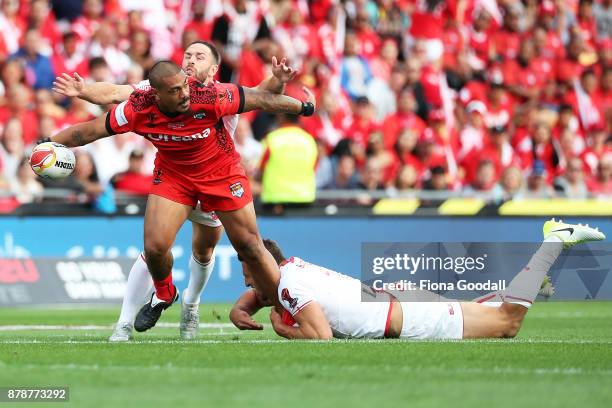 Sika Manu of Tonga passes the ball during the 2017 Rugby League World Cup Semi Final match between Tonga and England at Mt Smart Stadium on November...