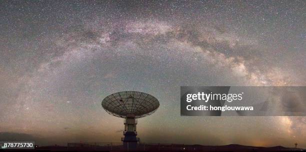 galaxy and radio telescope - starry vault stock pictures, royalty-free photos & images