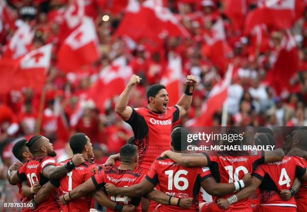 Jason Taumalolo of Tonga and teammates lay down the challenge prior to the Rugby League World Cup men's semi-final match between Tonga and England at...