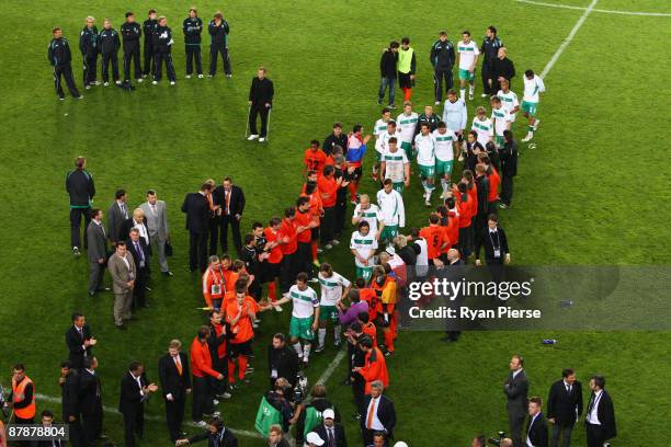 The Werder Bremen players are appluaded by the Shakhtar Donetsk players as they go to collect their loser's medals following their team's defeat...