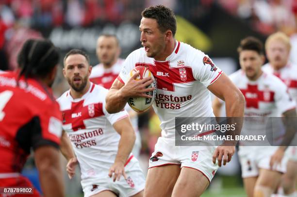 Sam Burgess of England takes the ball forward during the Rugby League World Cup men's semi-final match between Tonga and England at Mt Smart Stadium...