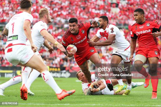 Andrew Fifita of Tonga heads for the try line under pressure during the 2017 Rugby League World Cup Semi Final match between Tonga and England at Mt...
