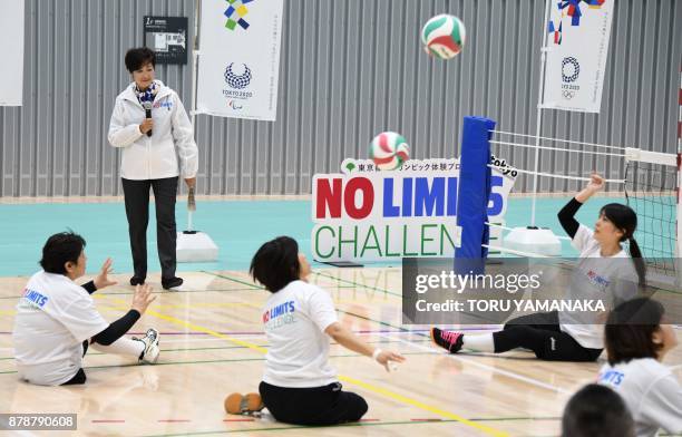 Tokyo Governor Yuriko Koike looks at workout of sitting volleyball after the opening ceremony of Musashino Forest Sports Plaza in Tokyo on November...