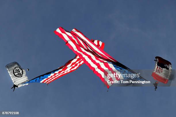 Skydivers jump with American flags before the TCU Horned Frogs take on the Baylor Bears at Amon G. Carter Stadium on November 24, 2017 in Fort Worth,...