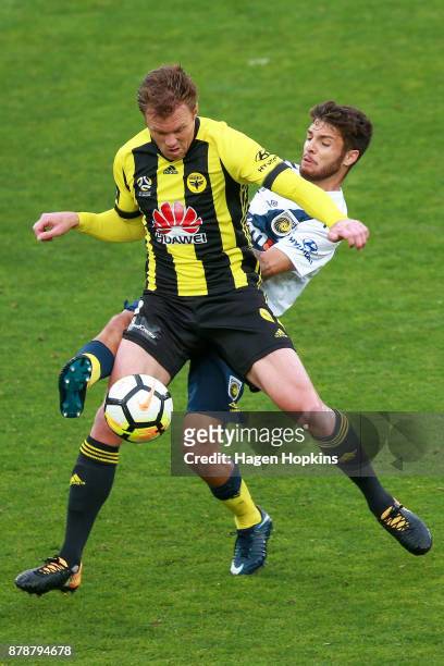 Michael McGlinchey of the Phoenix is challenged by Storm Roux of the Mariners during the round eight A-League match between the Wellington Phoenix...