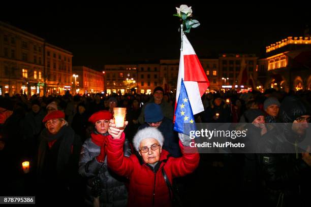 People protest at the Main Square against government plans for sweeping changes to Polands judicial system. Krakow, Poland on 24 November, 2017.
