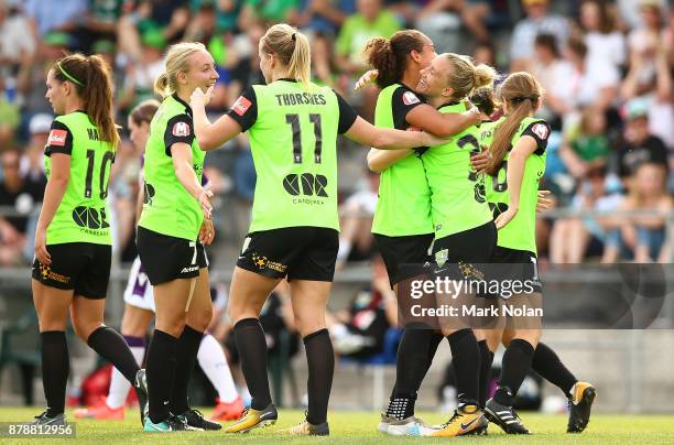 Laura Bassett of Canberra celebrates scoring a goal with team mates during the round five W-League match between Canberra United and Perth Glory at...