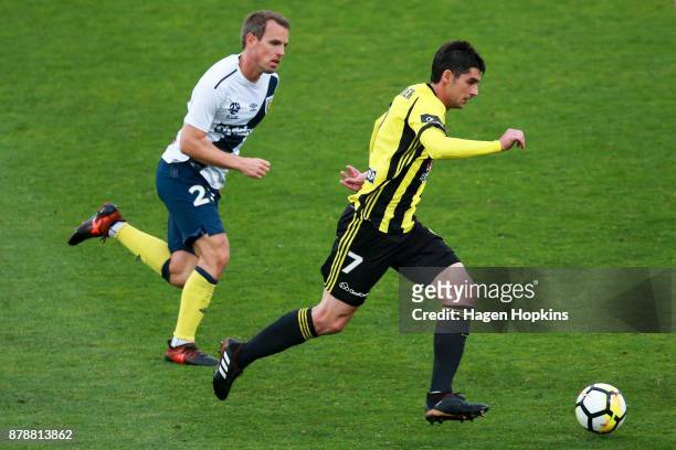 Gui Finkler of the Phoenix makes a break from Wout Brama of the Mariners during the round eight A-League match between the Wellington Phoenix and the...