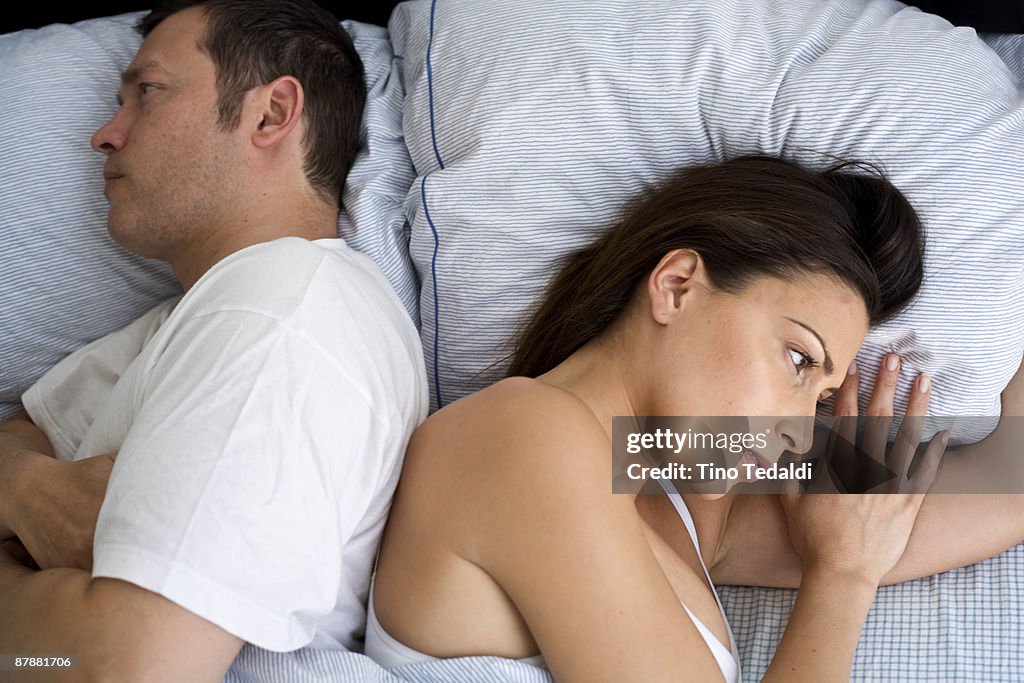 Young couple at home in bed