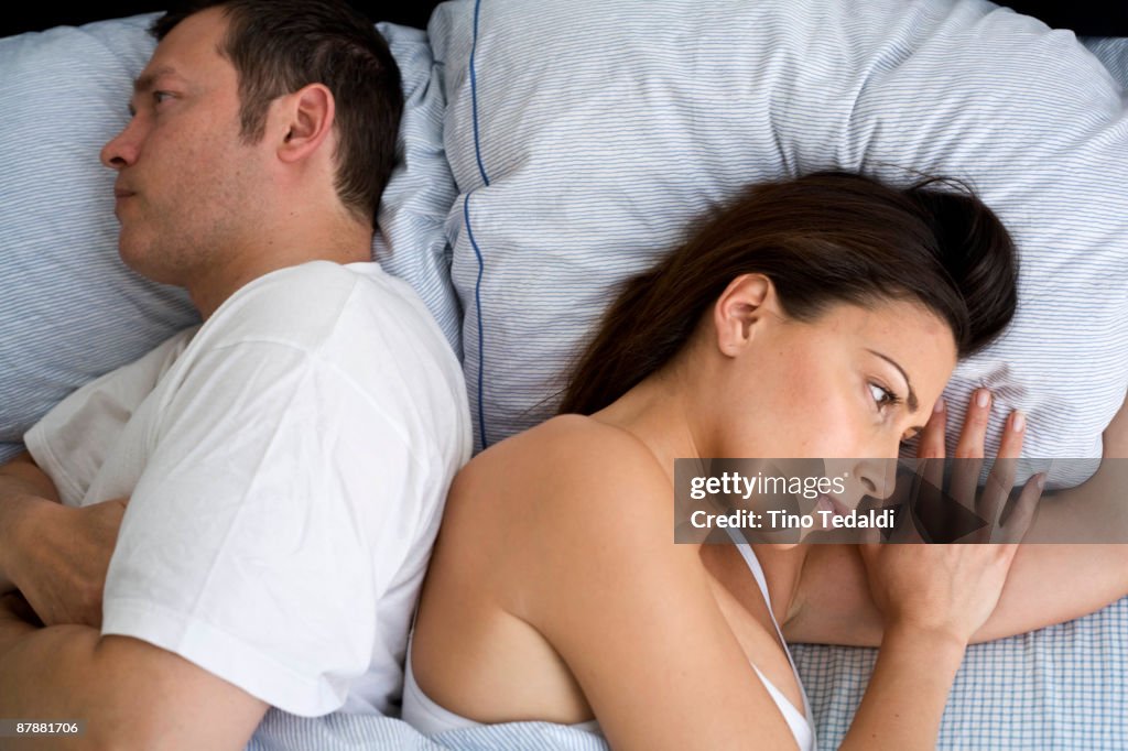 Young couple at home in bed