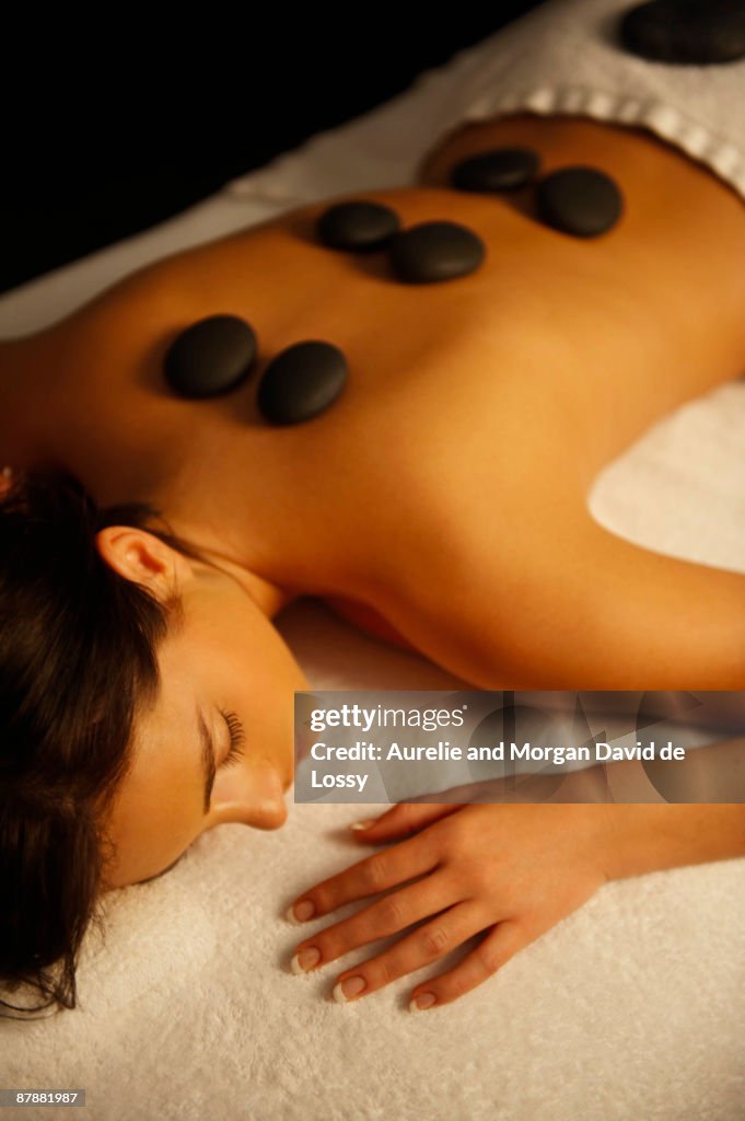 Woman receiving hot stone massage