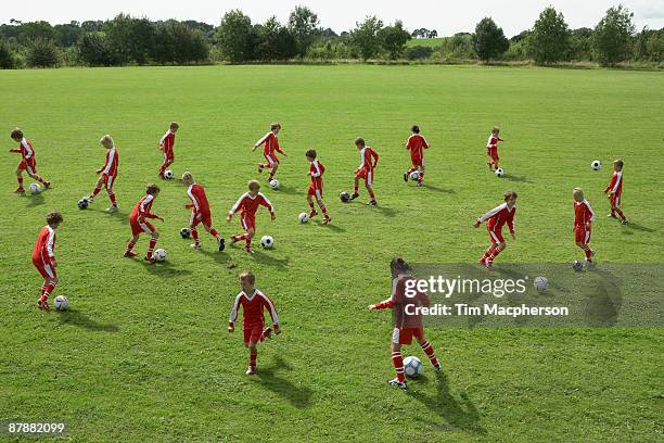 young footballers training - kids' soccer stock pictures, royalty-free photos & images
