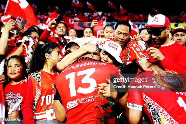 Jason Taumalolo of Tonga visits his family in the crowd after losing the 2017 Rugby League World Cup Semi Final match between Tonga and England at Mt...
