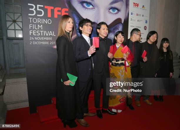 Laura Milani , President of the Turin Cinema Museum with the cast of one of the films in competition during the opening ceremony of he 35nd edition...