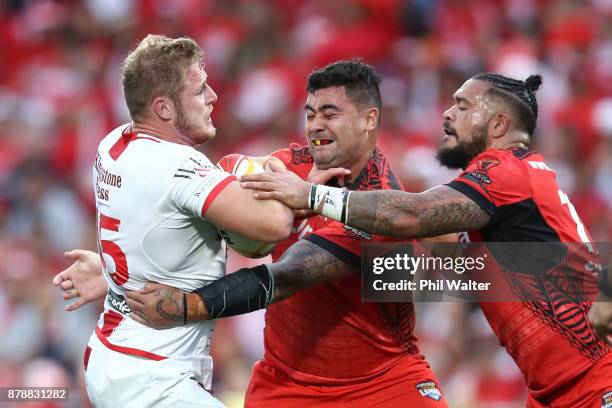 Thomas Burgess of England is tackled during the 2017 Rugby League World Cup Semi Final match between Tonga and England at Mt Smart Stadium on...