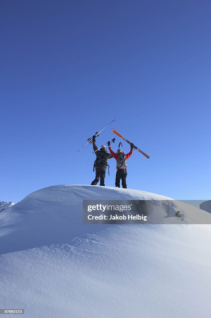 Skiers on top of mountain