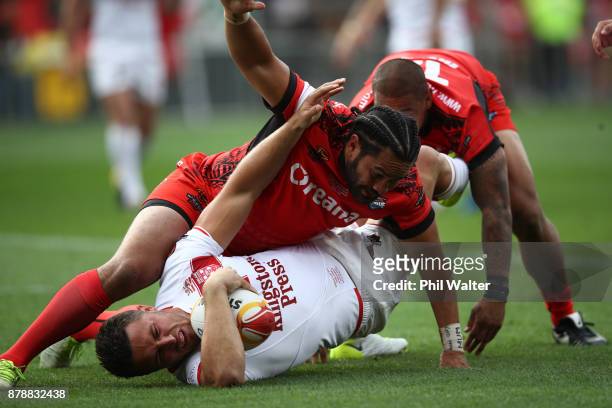 Samuel Burgess of England is tackled during the 2017 Rugby League World Cup Semi Final match between Tonga and England at Mt Smart Stadium on...