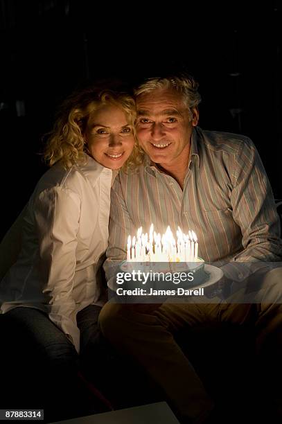 man and woman with cake - holding birthday cake stock pictures, royalty-free photos & images