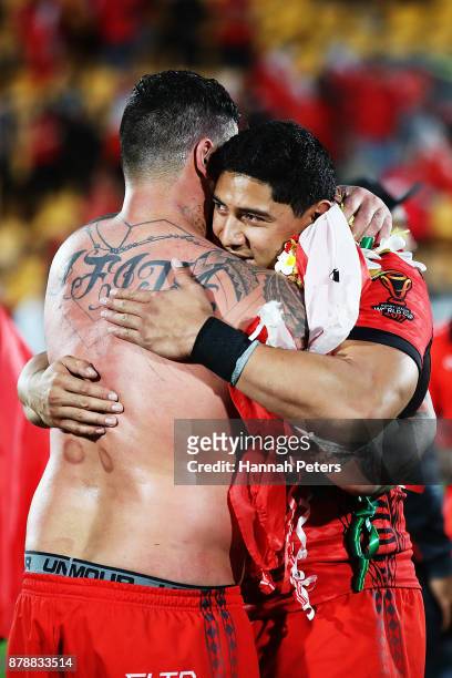 Andrew Fifita and Jason Taumalolo of Tonga embrace after losing the 2017 Rugby League World Cup Semi Final match between Tonga and England at Mt...