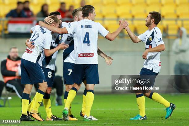 Trent Buhagiar of the Mariners celebrates with teammates after scoring a goal during the round eight A-League match between the Wellington Phoenix...