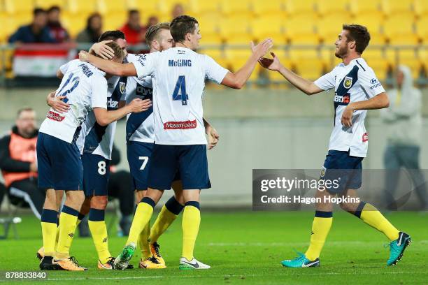 Trent Buhagiar of the Mariners celebrates with teammates after scoring a goal during the round eight A-League match between the Wellington Phoenix...