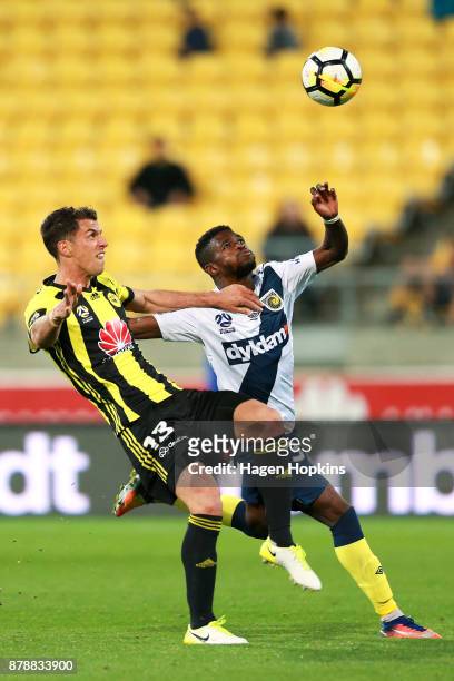 Marco Rossi of the Phoenix and Kwabena Appiah-Kubi of the Mariners compete for the ball during the round eight A-League match between the Wellington...