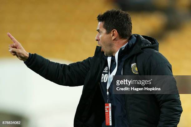 Coach Paul Okon of the Mariners talks to his players during the round eight A-League match between the Wellington Phoenix and the Central Coast...