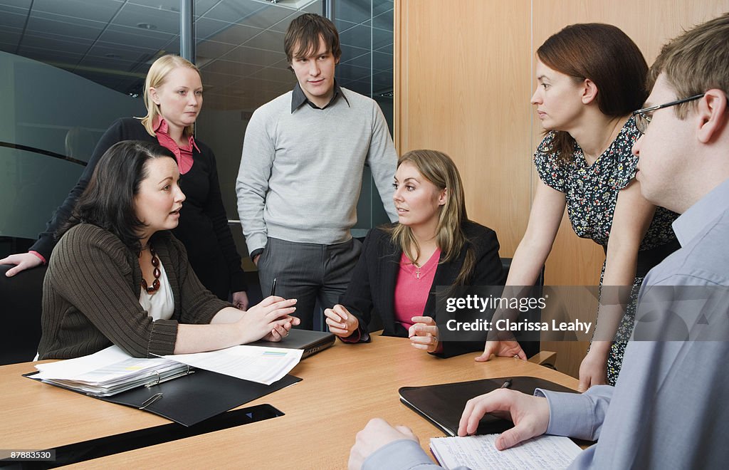 Colleagues meeting in boardroom