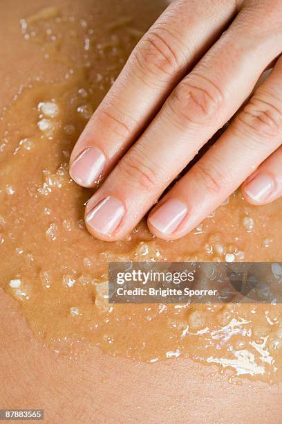 hand massaging skin - exfoliant stock pictures, royalty-free photos & images