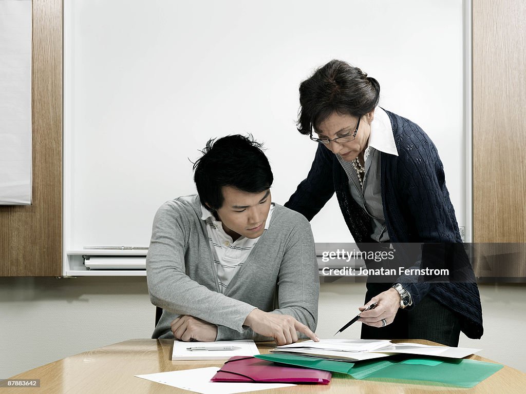 Business woman helping trainee