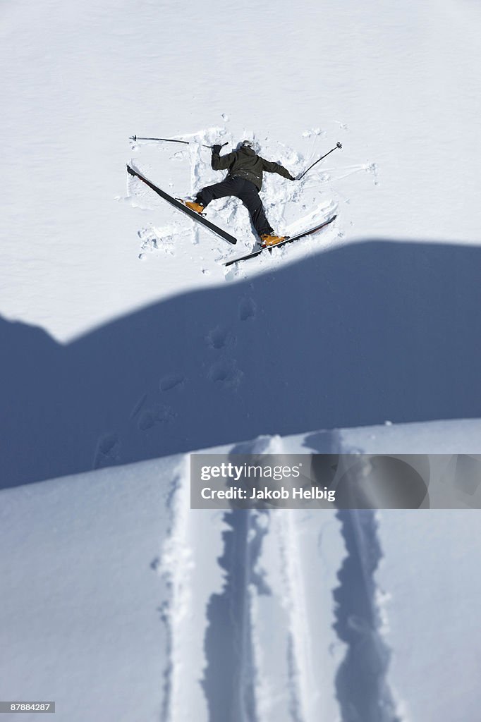 Skier head down in snow