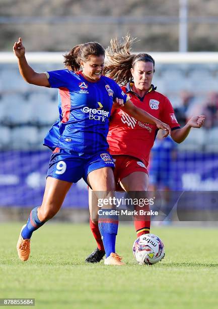 Katherine Stengel of Newcastle Jets competes with Kathleen Naughton of Adelaide United during the round five W-League match between Adelaide United...